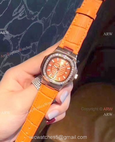 Copy Patek Philippe Nautilus Womens Watch Diamond Bezel Orange Watch 1