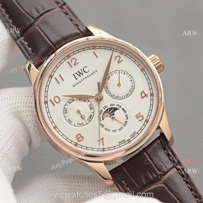 Replica IWC Portuguese Moonphase Gold Case White Face Watch 1