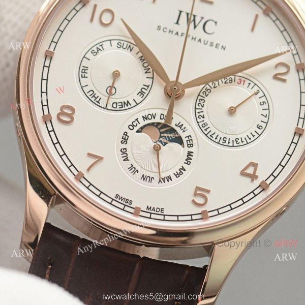 Replica IWC Portuguese Moonphase Gold Case White Face Watch 2