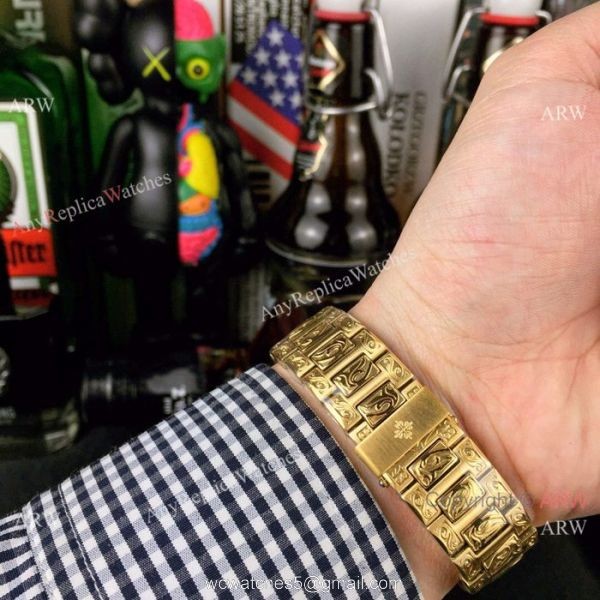 New Fake Patek Philippe Engraving Nautilus Silver Face Yellow Gold Watch For Sale 6